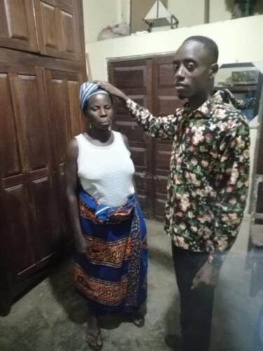 Student Emmanuel praying for the sick 