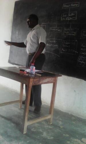 Class Session using the board in drawing Church Administration Organogram 