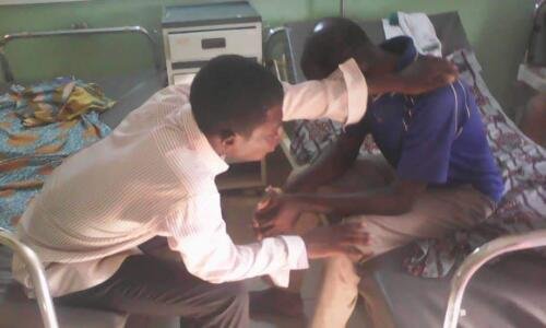 Student Mawulolo praying for the sick at the hospital (1)