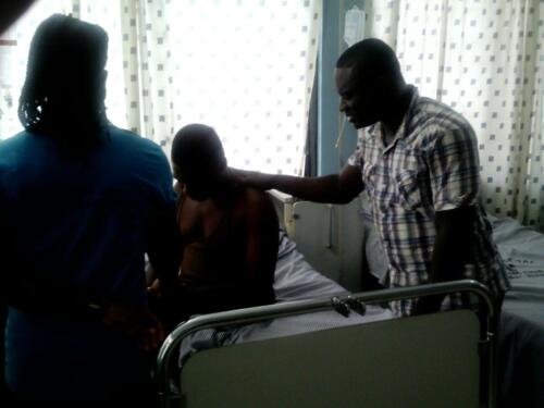 Student praying for the sick at the hospital