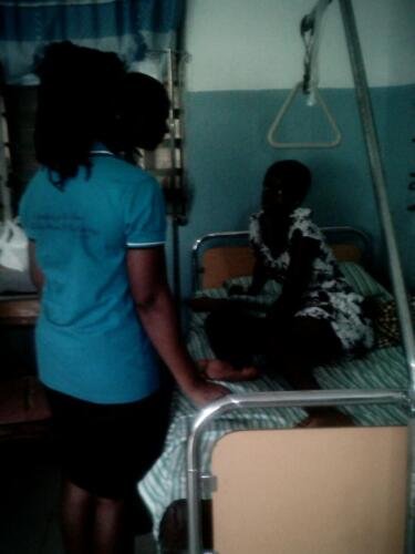 Student praying for the sick at the hospital (1)