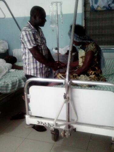 Student praying for the sick at the hospital (2)